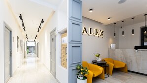 A hotel lobby with a long corridor, a reception desk, and a seating area with yellow chairs. - Alex Hotel (Yerevan)