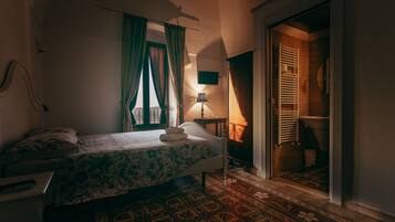 Comfort Quadruple Room, Private Bathroom | Minibar, desk, bed sheets