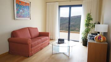 Apartment, 1 Bedroom | Living area | Flat-screen TV