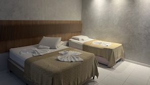 A hotel room with two beds, a wooden headboard, and a large window. - Pousada Marbello (Maragogi)