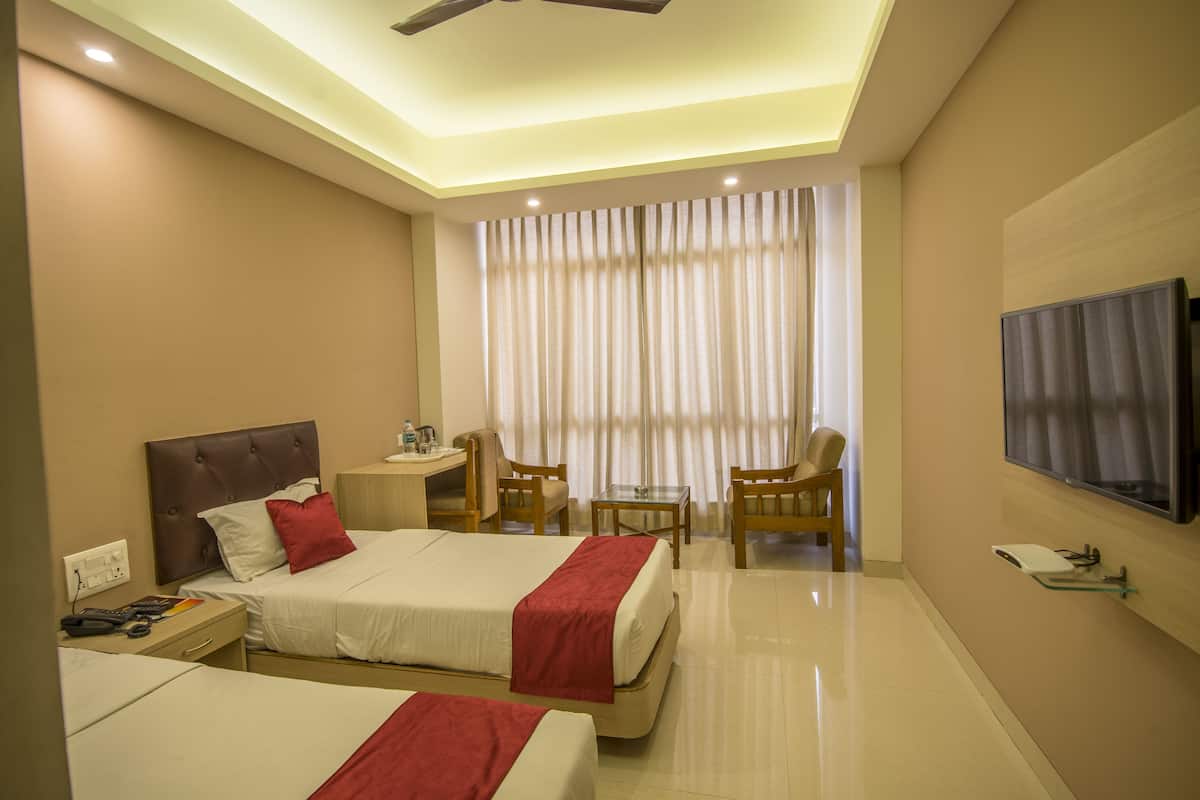 Habitación Deluxe con 1 cama matrimonial o 2 individuales, para no fumadores | 2 habitaciones, ropa de cama de alta calidad y escritorio