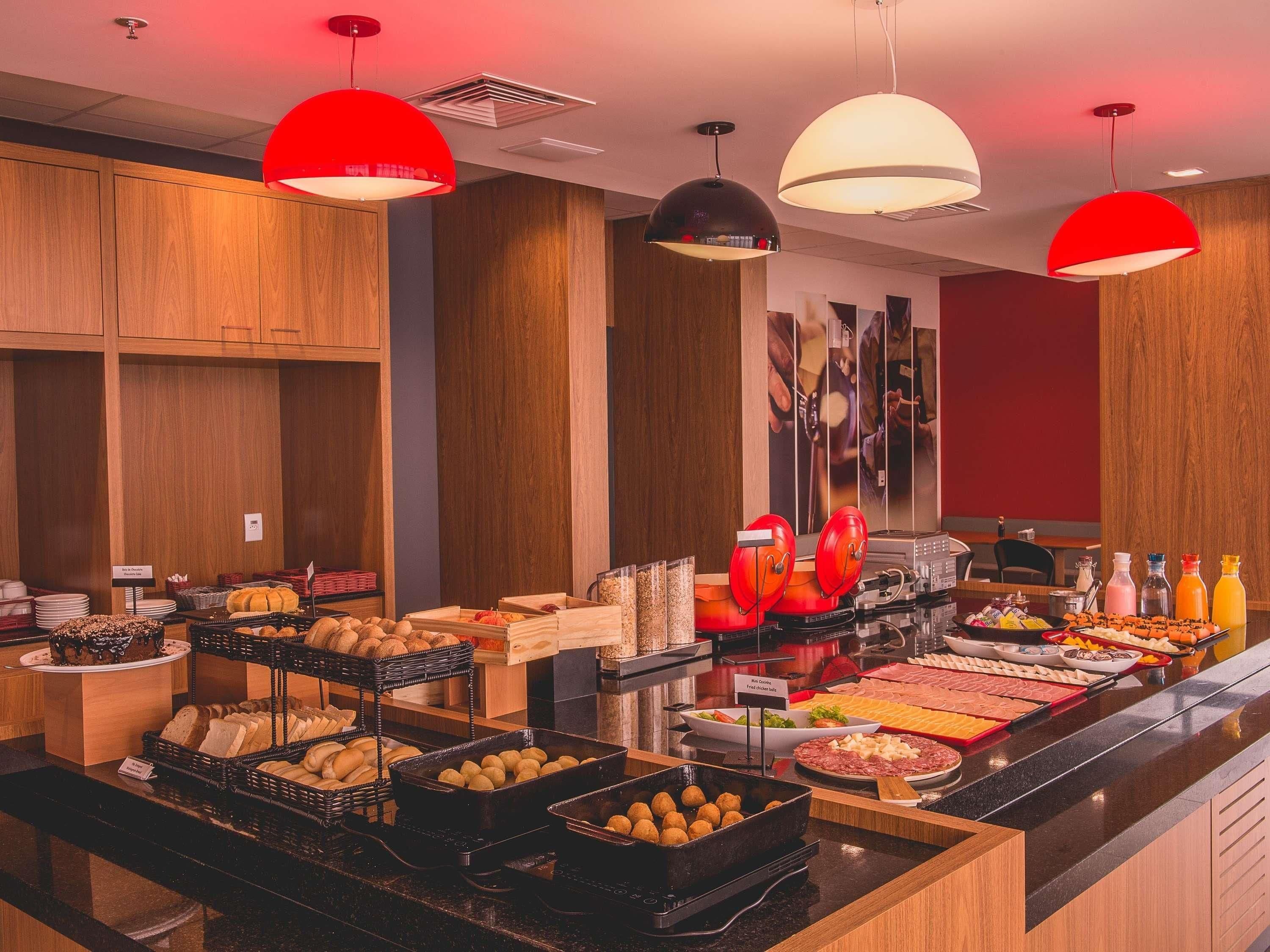 A buffet area with various food items and a coffee station.