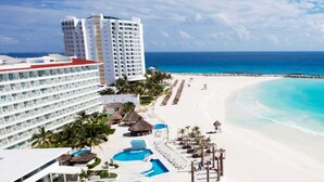A resort with a large pool, beach, and ocean view. - Krystal Cancun All Inclusive (Cancun)