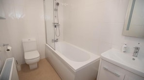 Banheira, toalhas de banho