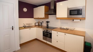 Fridge, microwave, oven, cookware/dishes/utensils