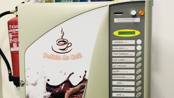 A coffee machine with a coffee cup graphic and a list of drink options.