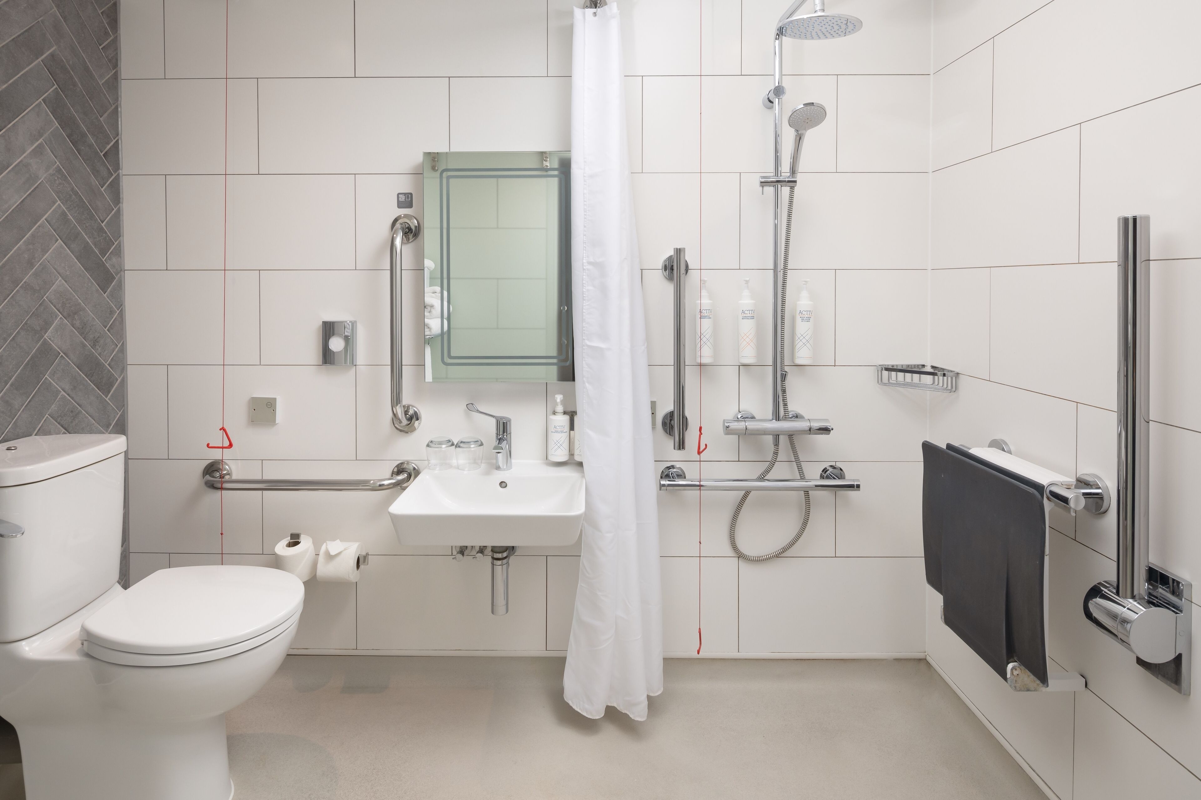 shower, designer toiletries, hair dryer, towels