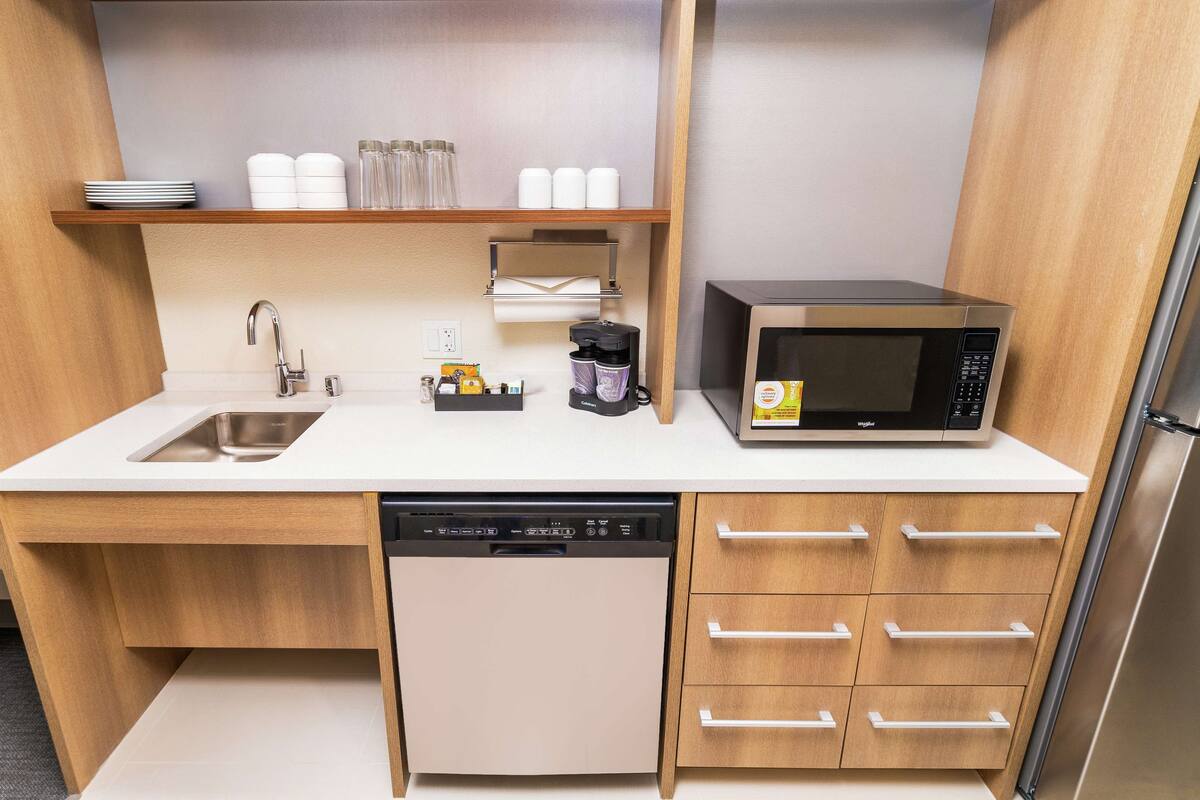 full-sized fridge, microwave, stovetop, dishwasher