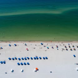 On the beach, white sand, sun-loungers