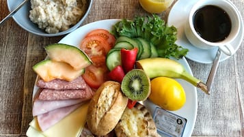 Enjoy a hearty breakfast spread with a variety of fresh fruits, vegetables, and proteins.