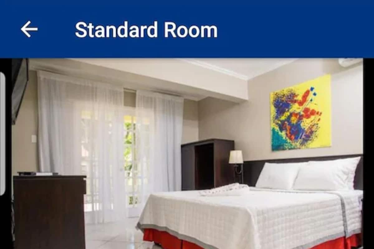 Standard Room | 1 bedroom, desk, blackout drapes, iron/ironing board