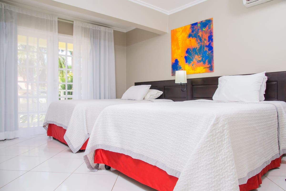 Junior Suite, 1 Bedroom, Ocean View | 1 bedroom, desk, blackout drapes, iron/ironing board