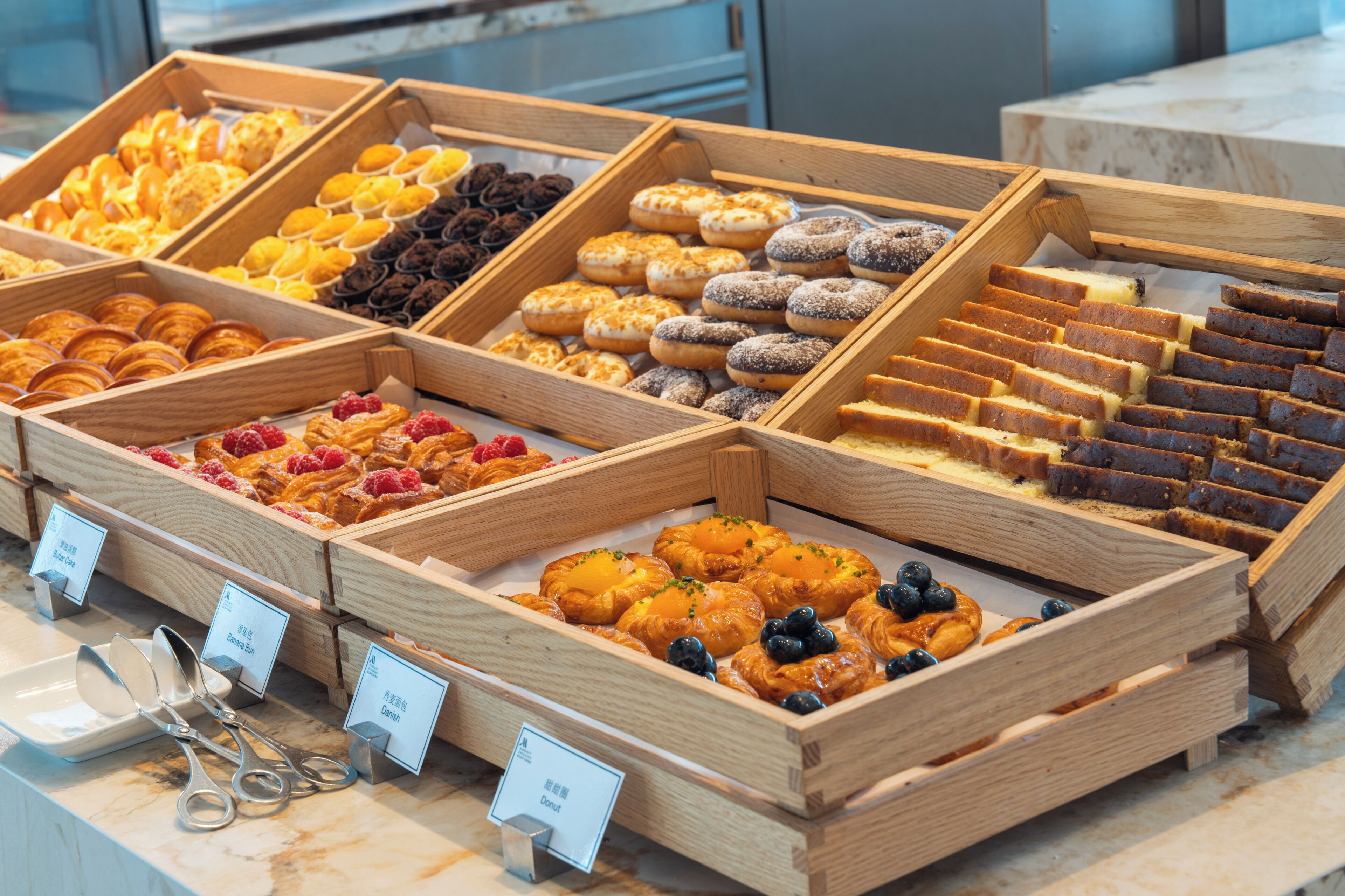 A bakery display with various pastries and baked goods.