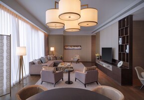 Regency, Executive Suite | Living area | 65-inch Smart TV with satellite channels, TV