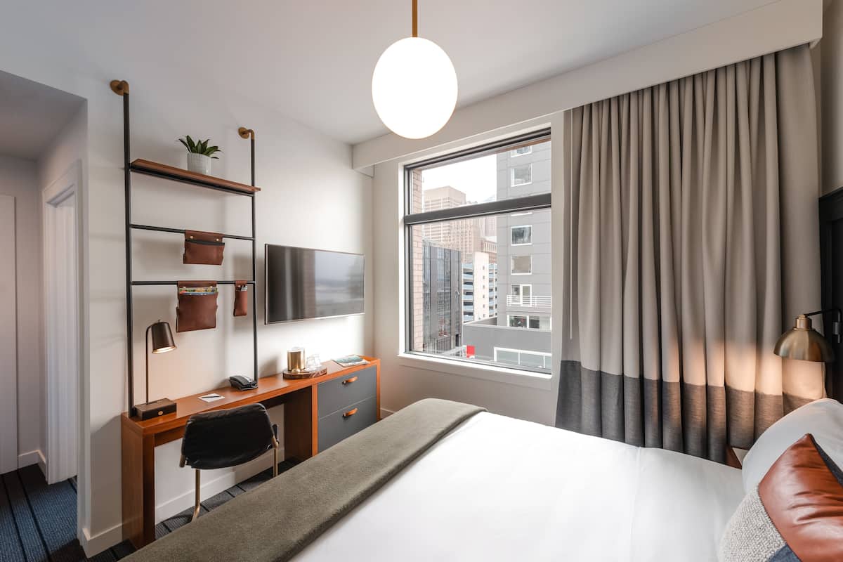 Room, 1 King Bed, City View | In-room safe, desk, laptop workspace, blackout curtains