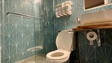 Shower, hair dryer, towels, soap