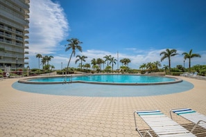 A heated pool - Beachfront 2BR condo with pool, WiFi, and cool comfort in Marco Island. (Marco Island)