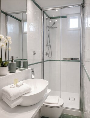Combined shower/tub, hair dryer, towels, soap