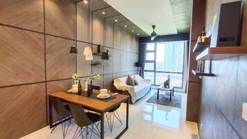 Luxury Condo, Multiple Beds | Living area | 43-inch LED TV with digital channels, TV, first-run movies