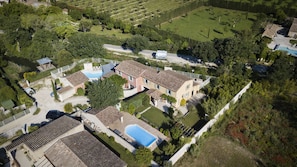 Set amidst a serene garden and pool, this two-story house offers a peaceful retreat.