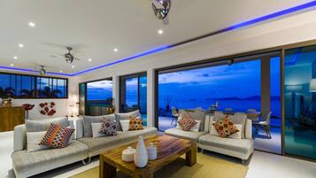 Una televisión, un reproductor de DVD, libros, una biblioteca de música