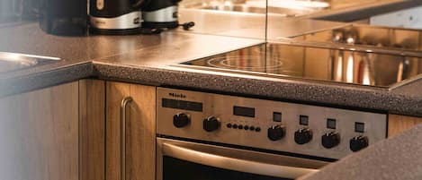 Fridge, stovetop, dishwasher, coffee/tea maker