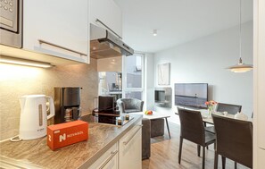 Fridge, stovetop, dishwasher, coffee/tea maker
