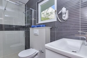 Shower, hair dryer, towels, soap