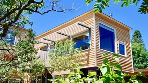 A modern wooden house with large windows and a balcony. - The Aurora- Award Winning- Sauna available (Grand Marais)
