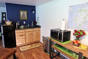 Fridge, microwave, coffee/tea maker, cookware/dishes/utensils