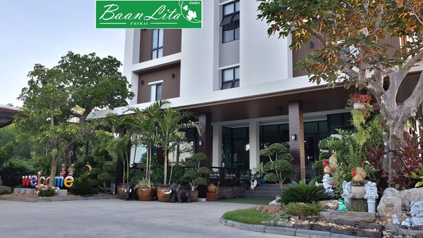 A modern building with a sign reading "Baan Lita PHIMAI".