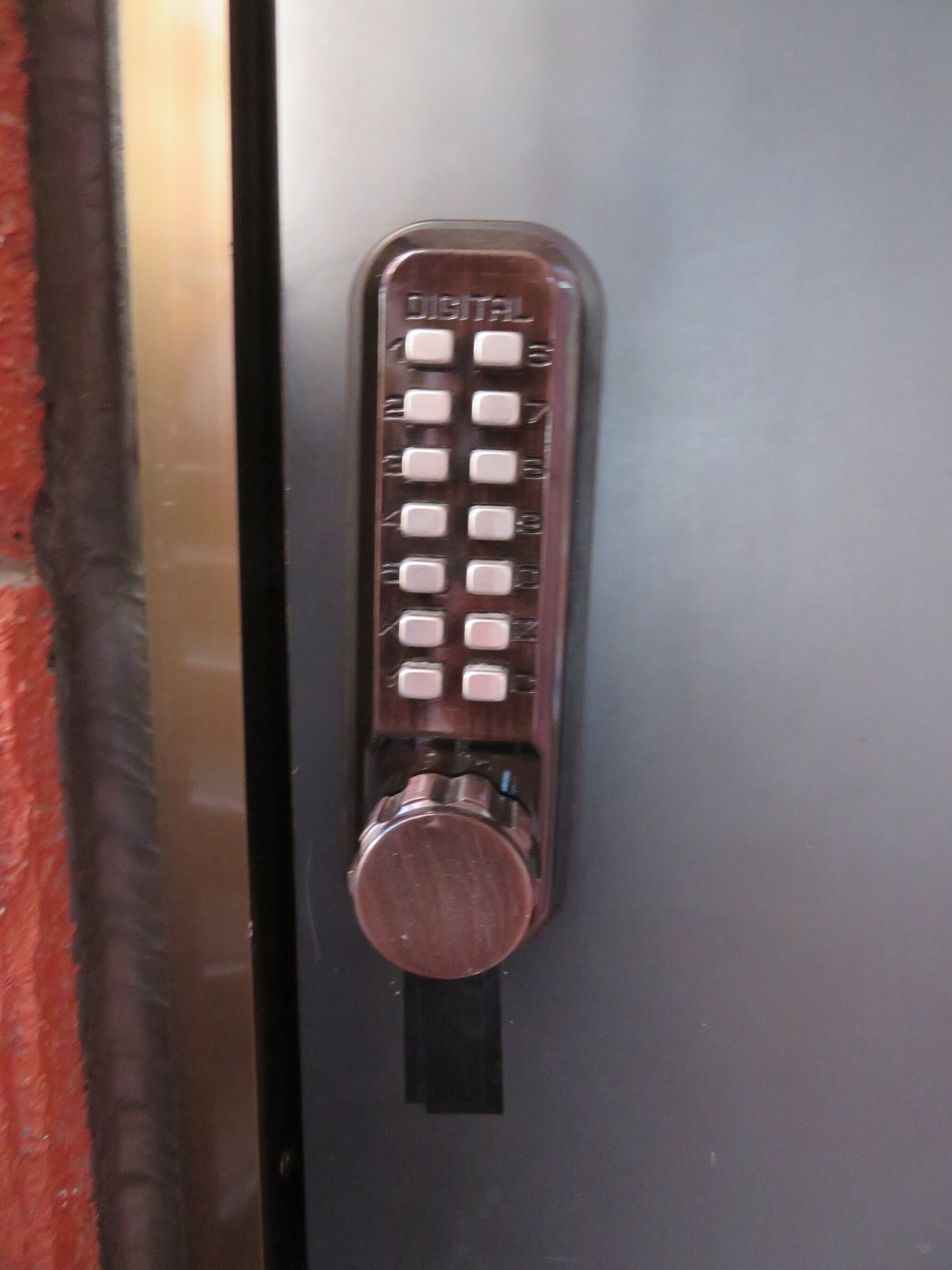 A digital keycard with a metallic finish and a black keyhole.