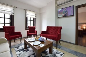 Family Suite, Garden View | Living area | LCD TV