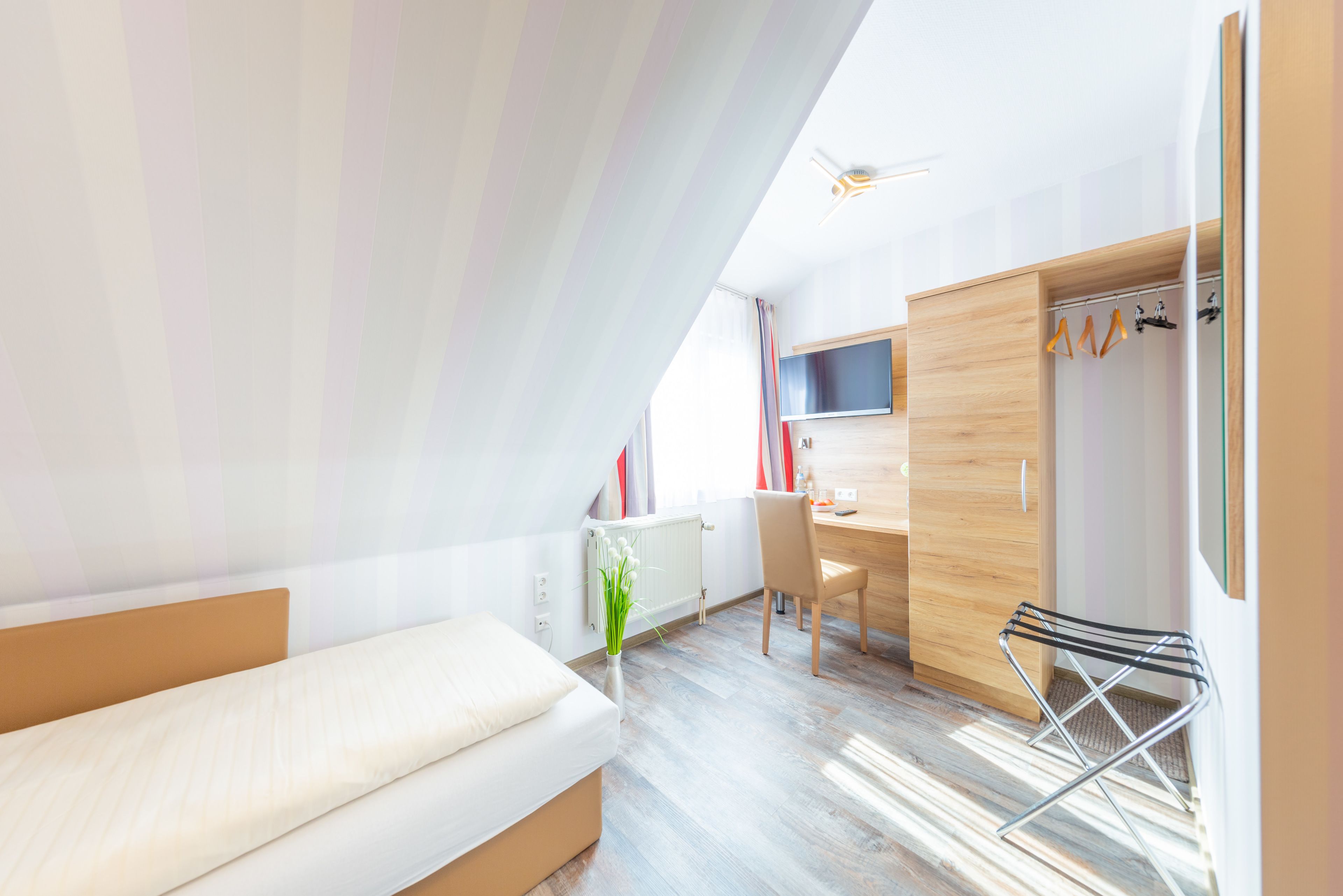 hypo-allergenic bedding, desk, blackout curtains, soundproofing