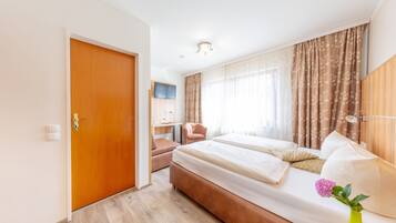 Hypo-allergenic bedding, desk, blackout drapes, soundproofing