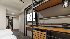A hotel room with a bunk bed, a desk with a computer, and a wardrobe. - ICI HOTEL Asakusabashi (Tokyo)