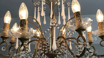 A chandelier with multiple light fixtures and decorative elements.