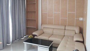 Apartamento executivo, 1 quarto | Área de estar