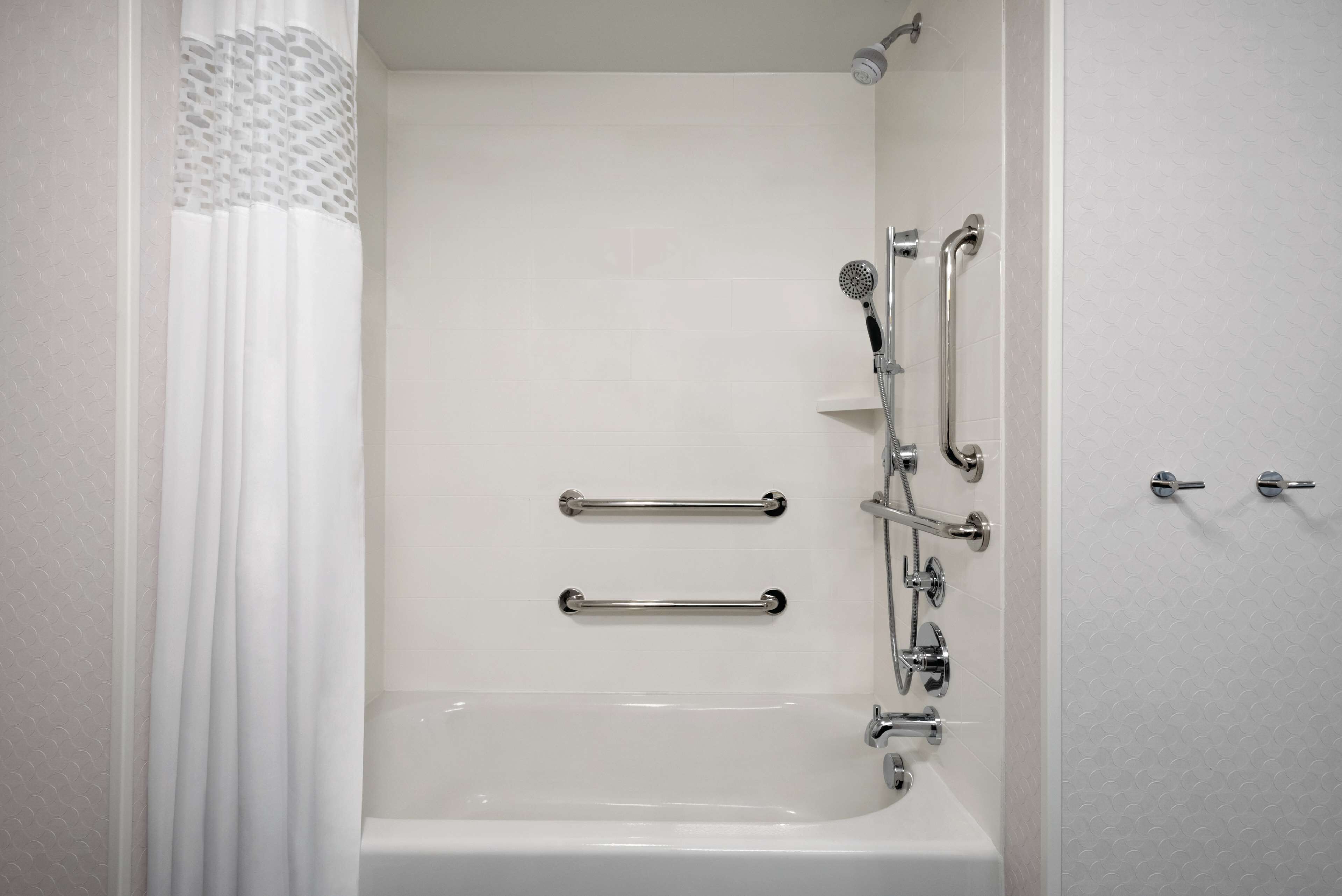 combined shower/bathtub, designer toiletries, hair dryer, towels