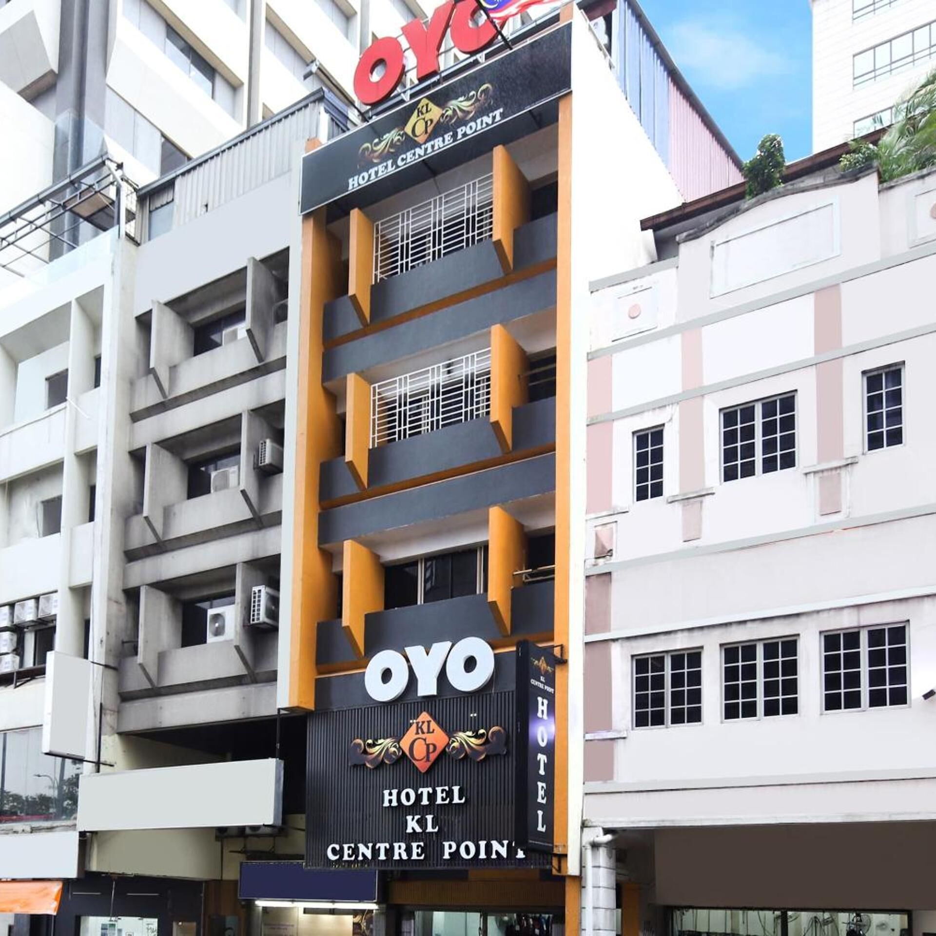 A hotel building with a prominent sign for 'OYO HOTEL KL CENTRE POINT'.