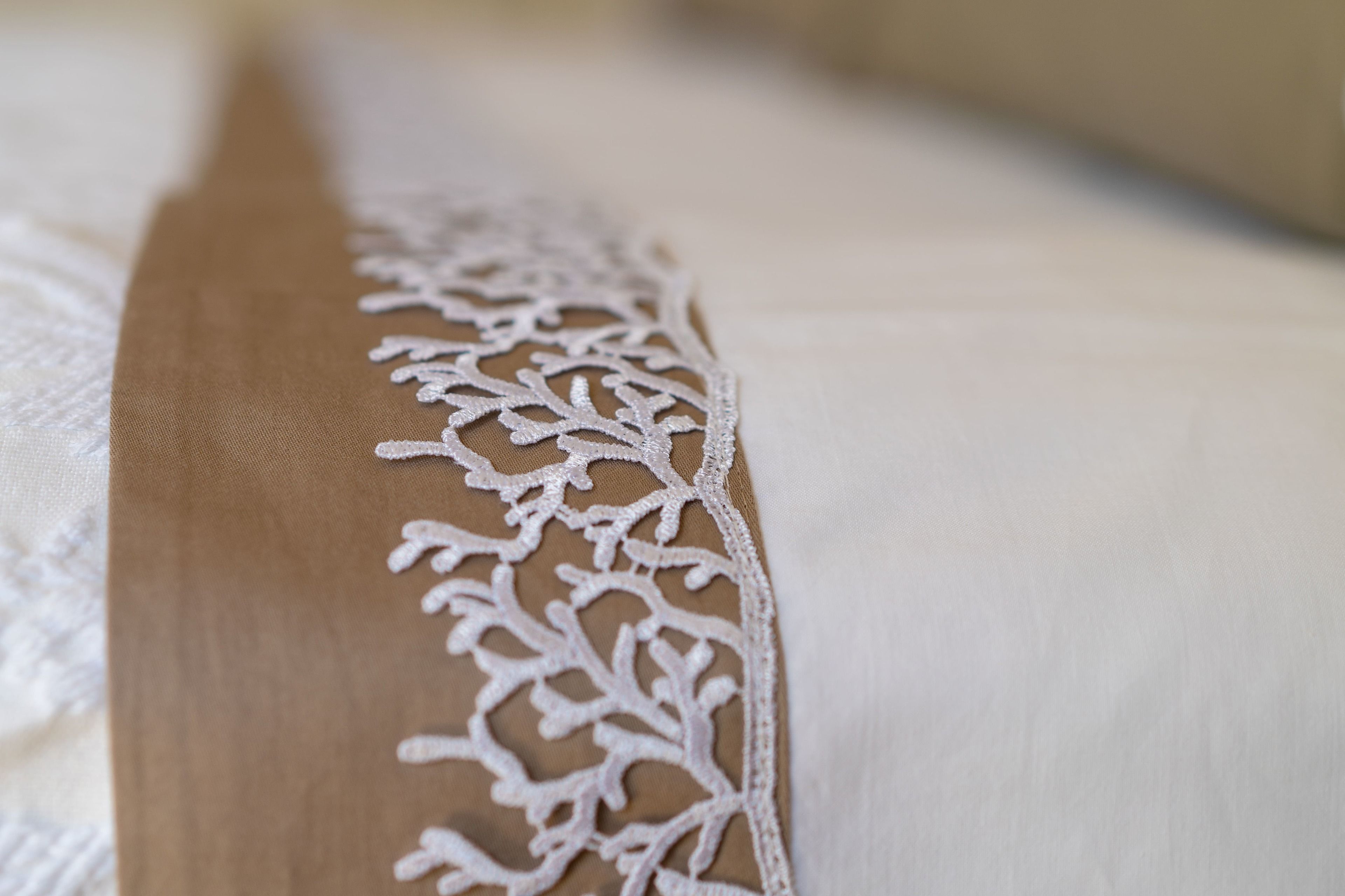 A close-up of a fabric with a lace pattern.