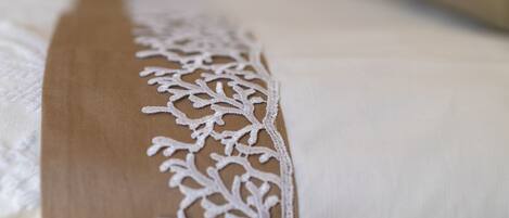 A close-up of a fabric with a lace pattern.