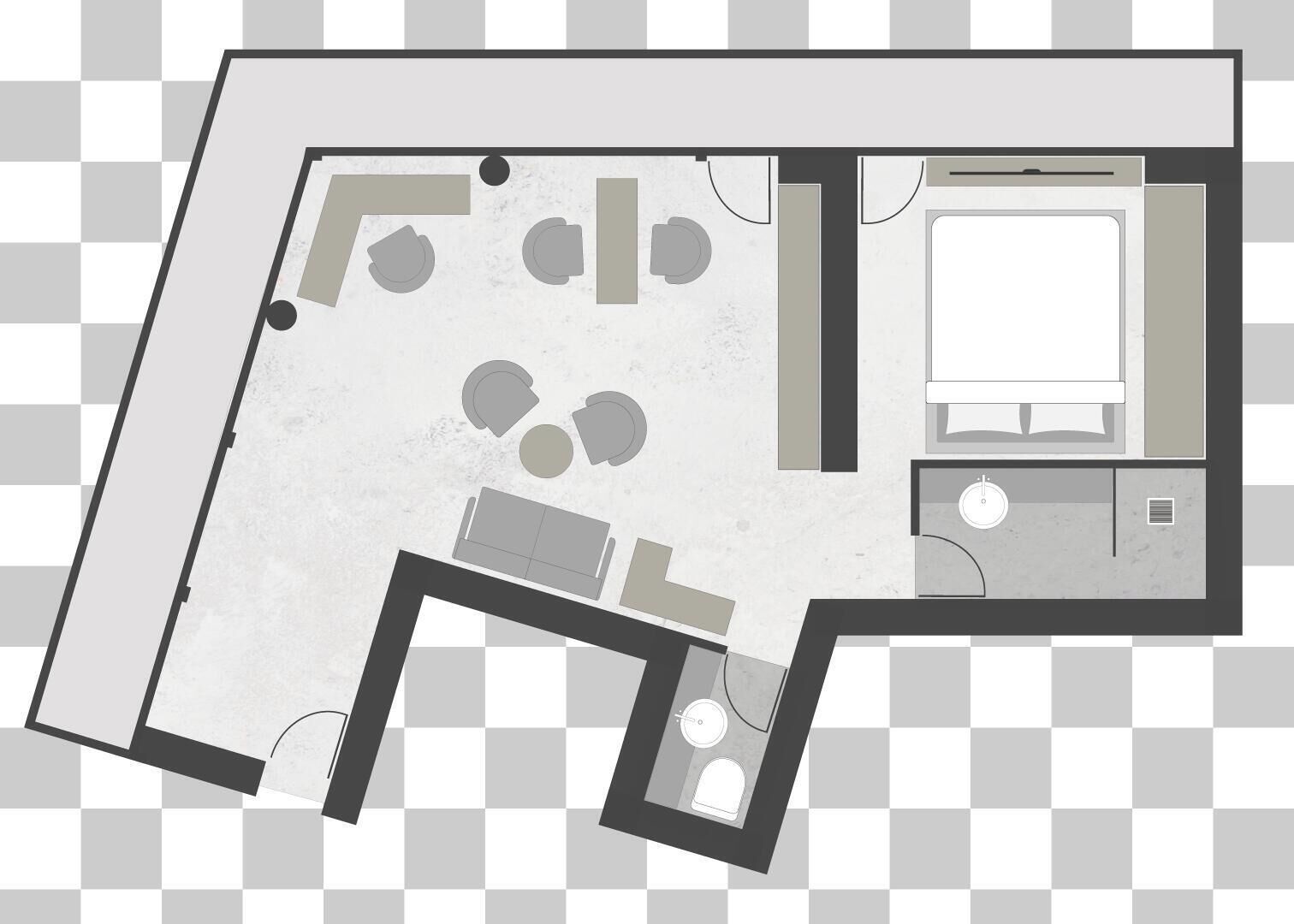 A hotel room layout with a bed, a desk, a chair, a small bathroom, and a seating area with a table and chairs.