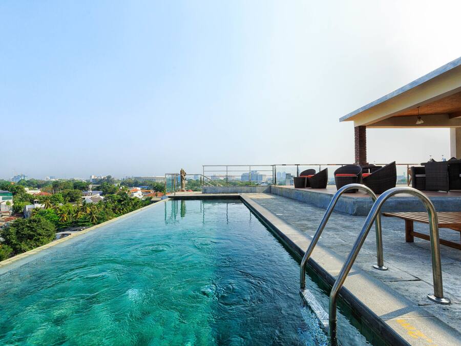 Outdoor pool, open 6 AM to 10:00 PM, pool umbrellas, lifeguards on site