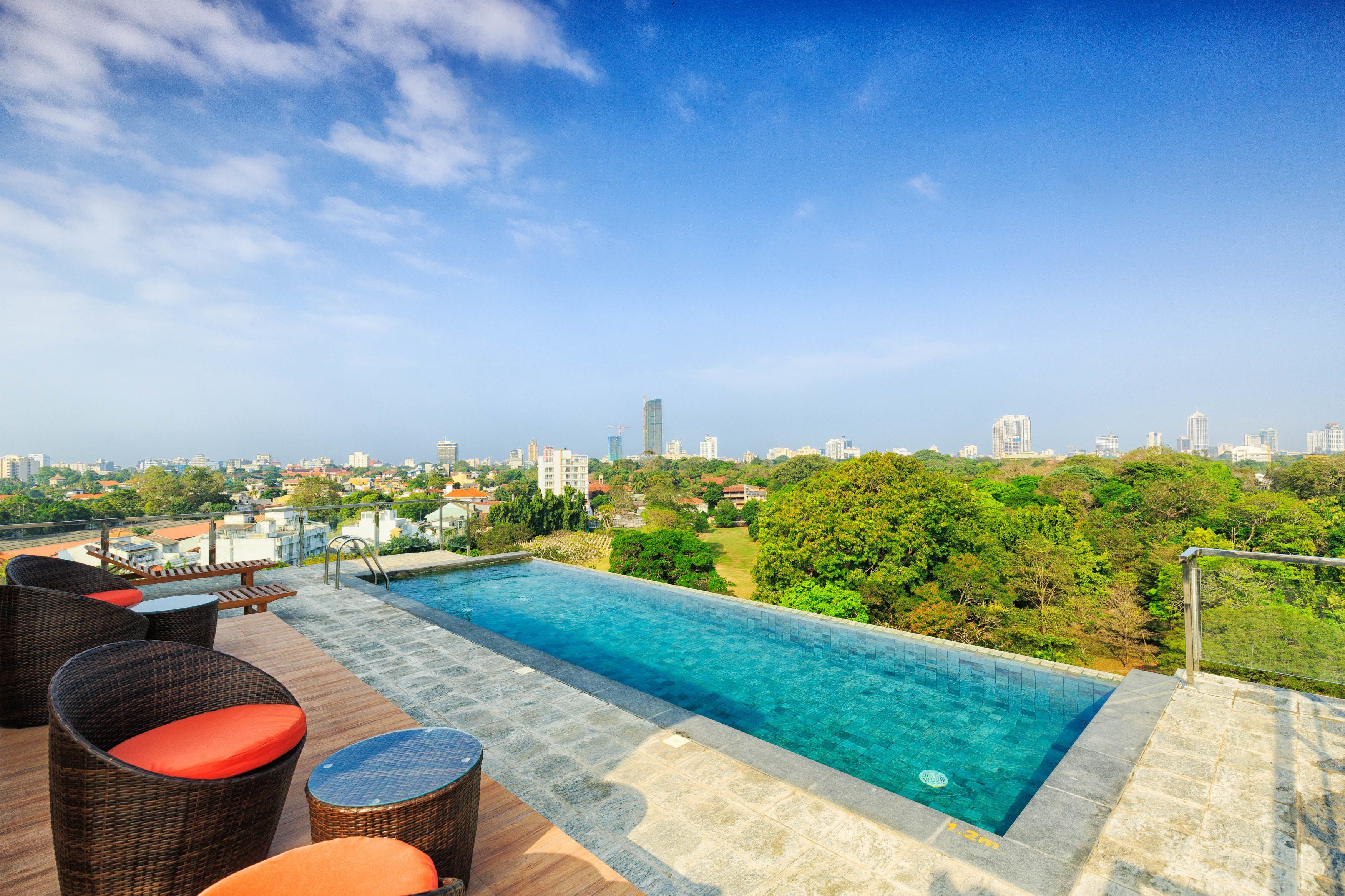 Outdoor pool, open 6 AM to 10:00 PM, pool umbrellas, lifeguards on site