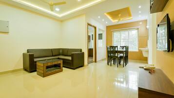 Double or Twin Room | Living area | TV