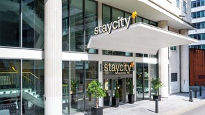 A modern building with a 'staycity' sign, large windows, and potted plants in front. - Staycity Aparthotels, Liverpool, Waterfront (Liverpool)