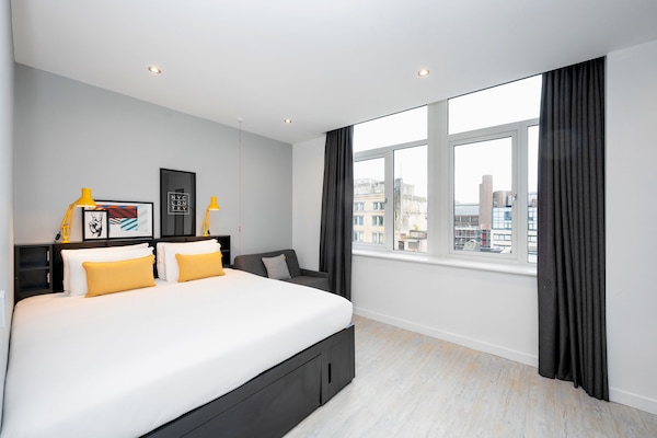 Premium bedding, desk, blackout curtains, iron/ironing board