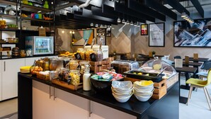 A buffet area with various food items and condiments. - Staycity Aparthotels, Liverpool, Waterfront (Liverpool)