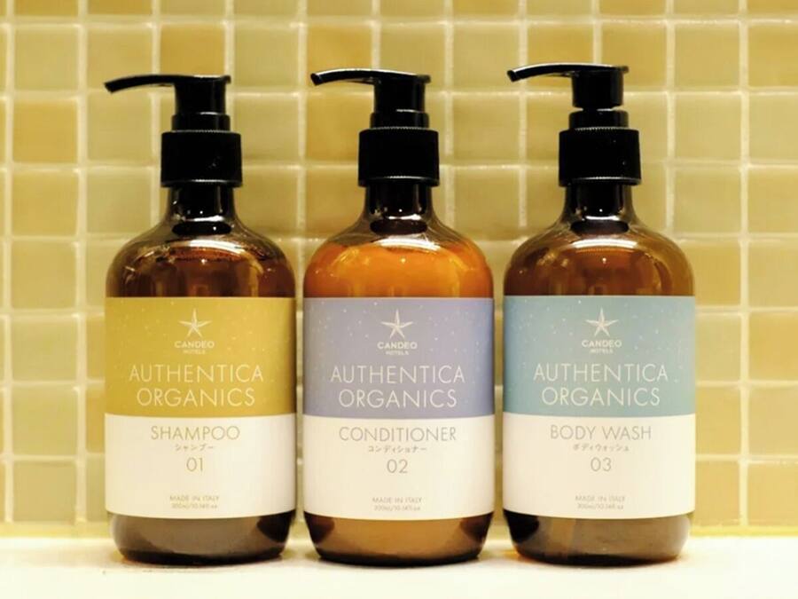 Three bottles of Authentic Organics products: Shampoo, Conditioner, and Body Wash.